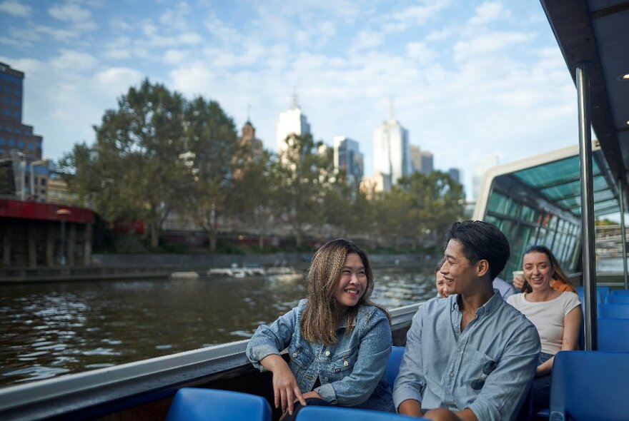 People enjoying a cruise on the Yarra River. 