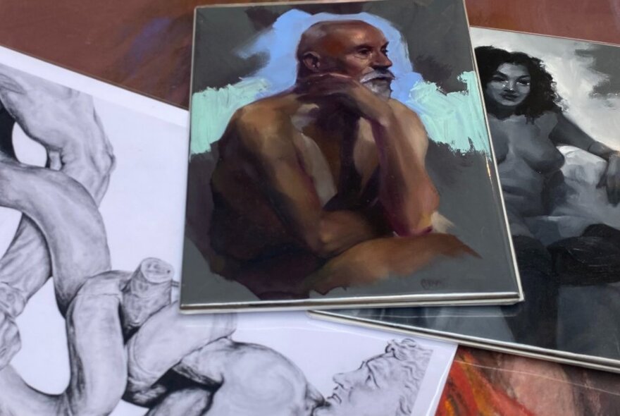 Three featured artworks: two oil portraits and one classical Laocoon sketch.