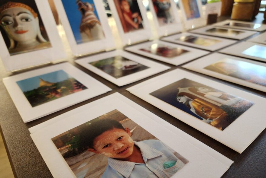 Framed portraits lined up in rows.