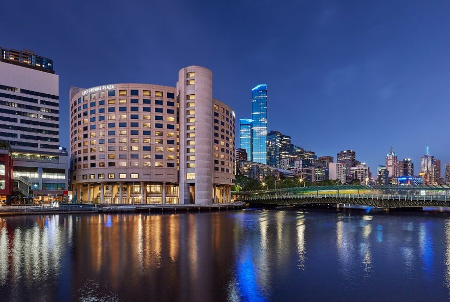 The Crowne Plaze hotel on the banks of the Yarra River in Melbourne at night. 