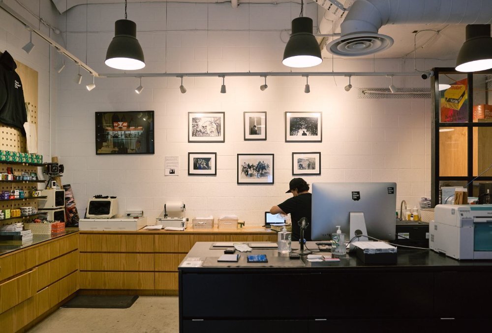 A film shop with a computer desk and cameras.