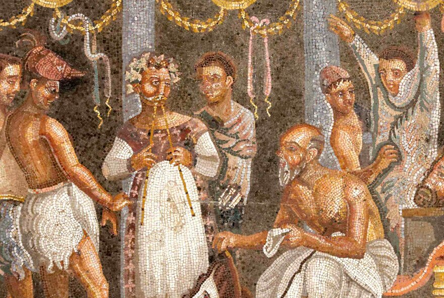 An ancient Roman mosaic showing a group of theatre actors and musicians preparing for a performance.