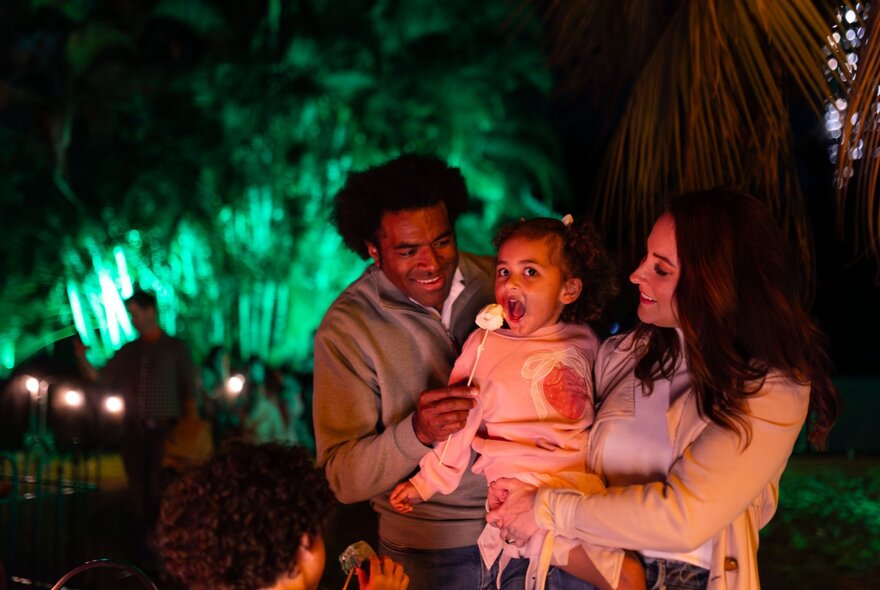 A family enjoying an evening outdoors; part of Lightscape at Royal Botanic Gardens.