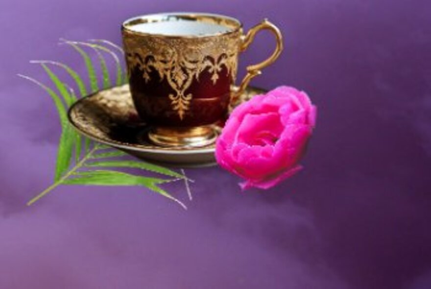 Gilded teacup and saucer floating in a purple sky with a fern and rose.