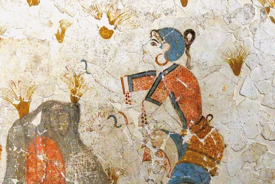 Ancient wall painting of a girl wearing jewellery.