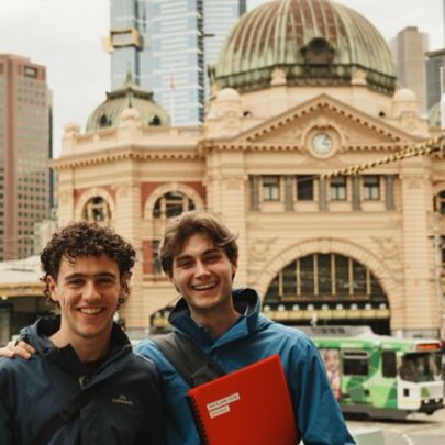 To tour leaders in front of Flinders St Station.