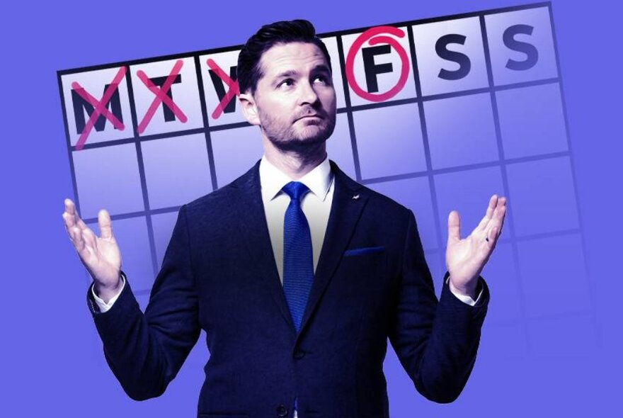 Charlie Pickering wearing a suit and tie, his arms raised, in front of a calendar with F for Friday circled.