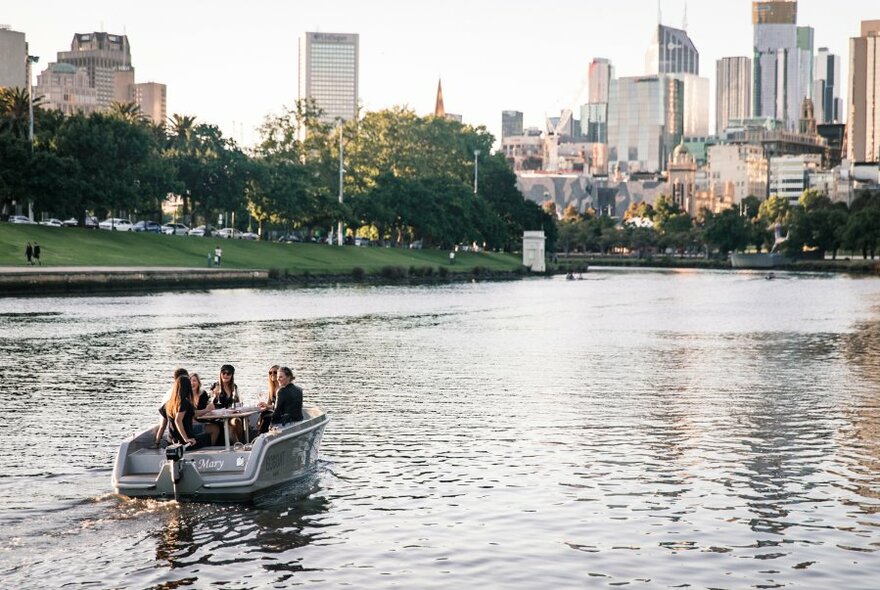 A group of people on a boat on the Yarra River. 