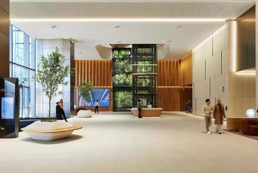 Interior lobby of the Melbourne Quarter, the space features a vertical garden wall behind the main desk.