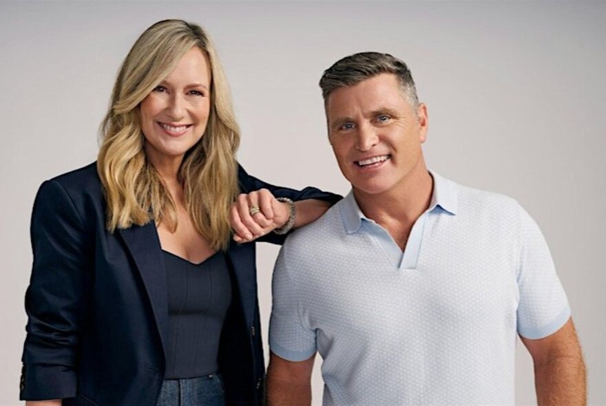 TV presenters Melissa Doyle and Shane Crawford, smiling and standing in front of a white background.