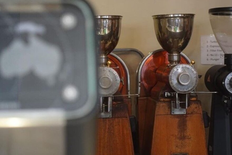 Two coffee grinding machines inside Quists Coffee.