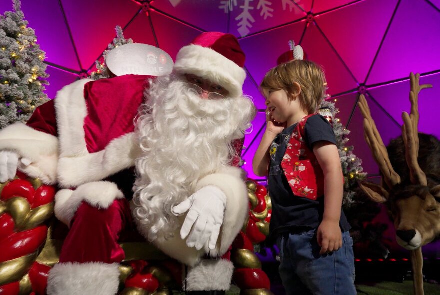 Sant speaking to a young child.