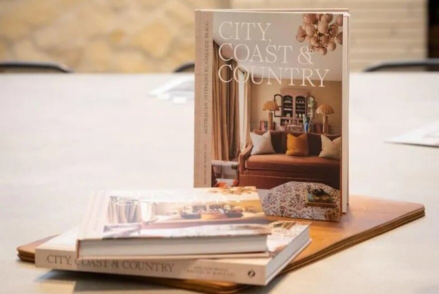 Selection of interior design books on a wooden board.