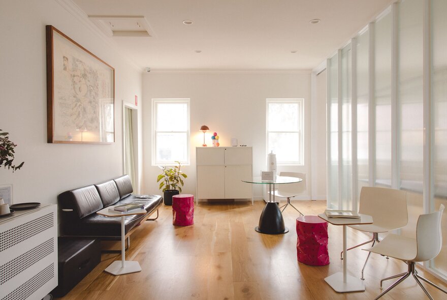 A white waiting room area with long windows. 