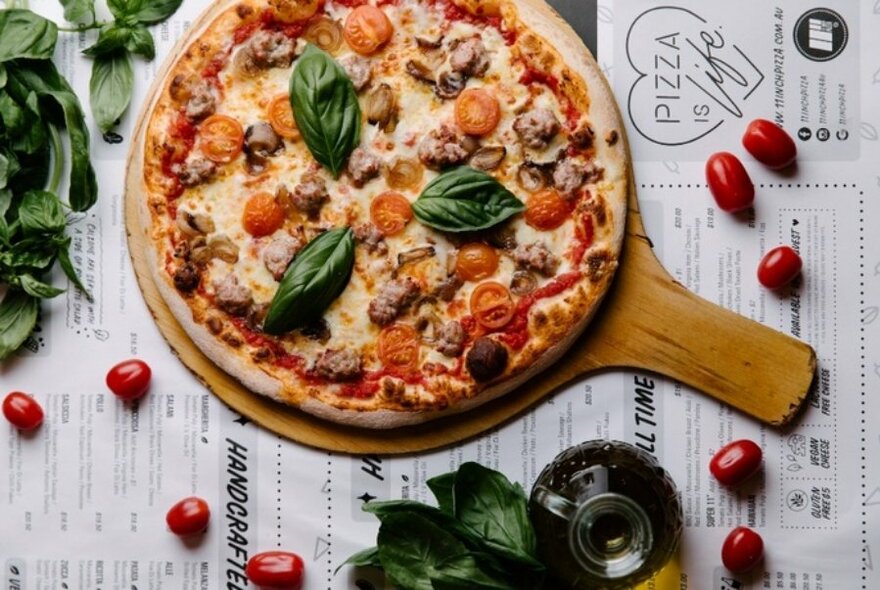 Sausage, tomato and basil pizza.