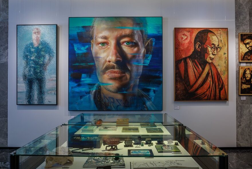 Paintings of portraits in a gallery.