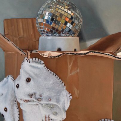 A still life painting of a cardboard box that contains a small mirror ball, and a piece of white fabric hanging off the side.