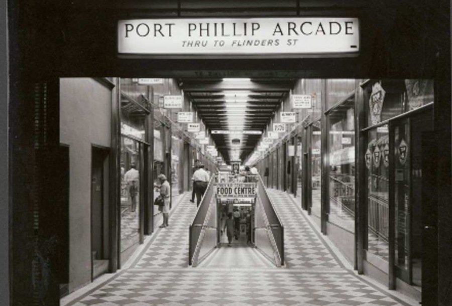 A black and white photo of an old arcade 
