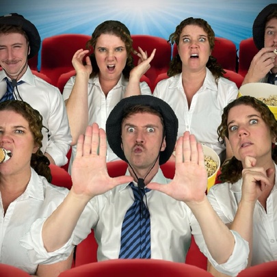 People seated in cinema seats with ice cream and popcorn, reacting to movies.