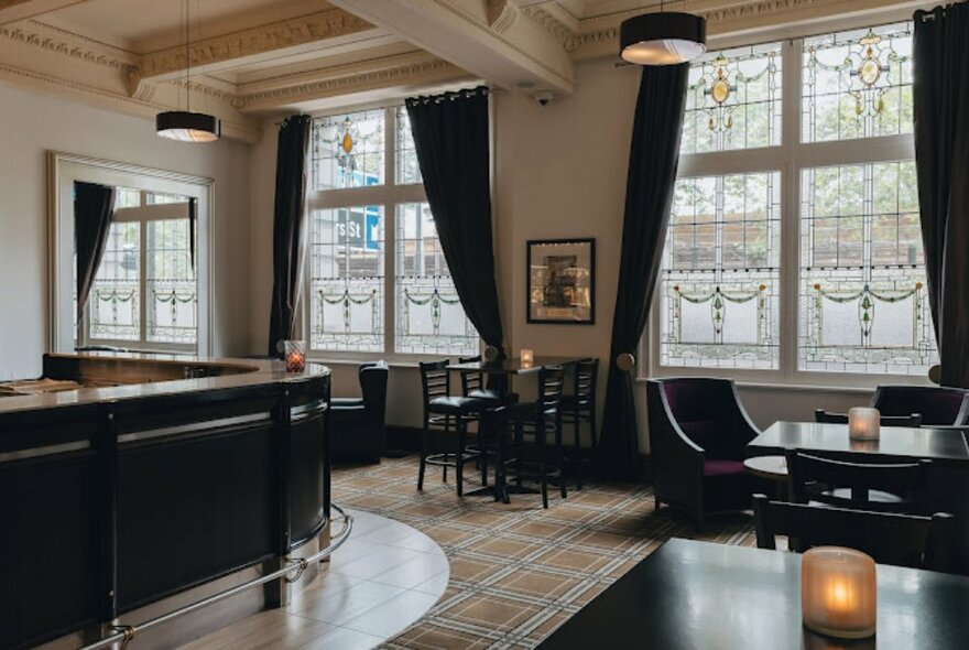 Interior of Ms Ava bar with a wooden bar and seating area. 