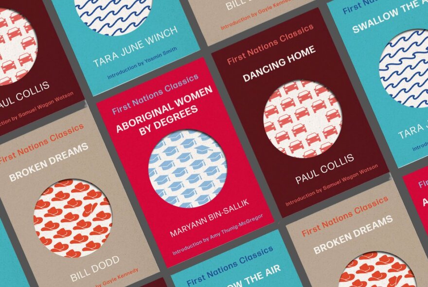 A display of different coloured book covers, all with the same template design of a circle and small pattern in the middle.
