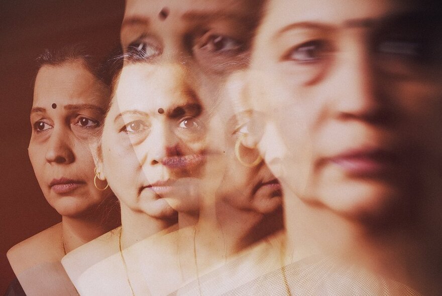 Fractured images of an Indian woman's face.