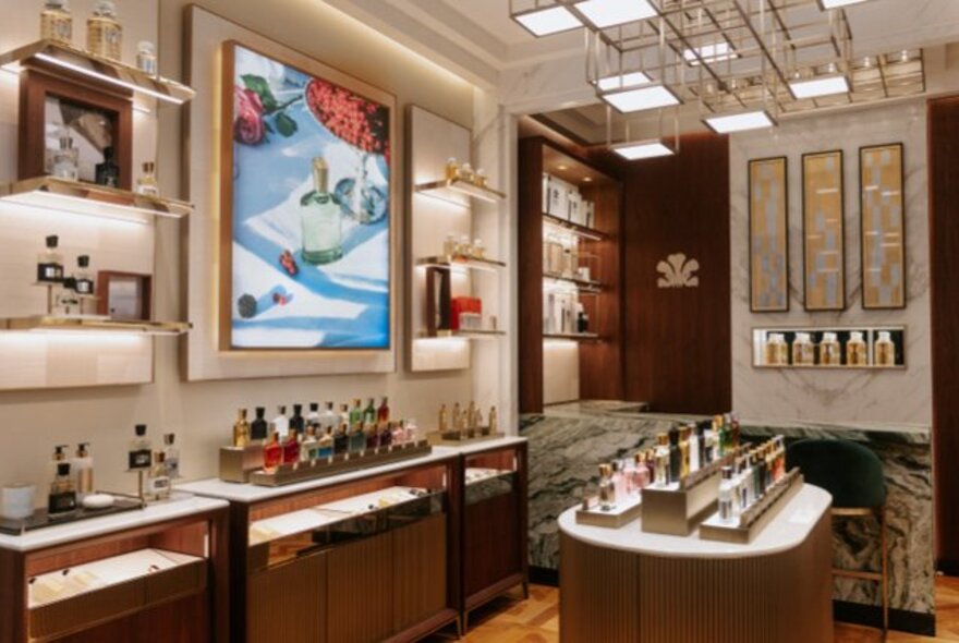 House of Creed perfumerie with tiny bottles on a centre island and arranged around the walls. 