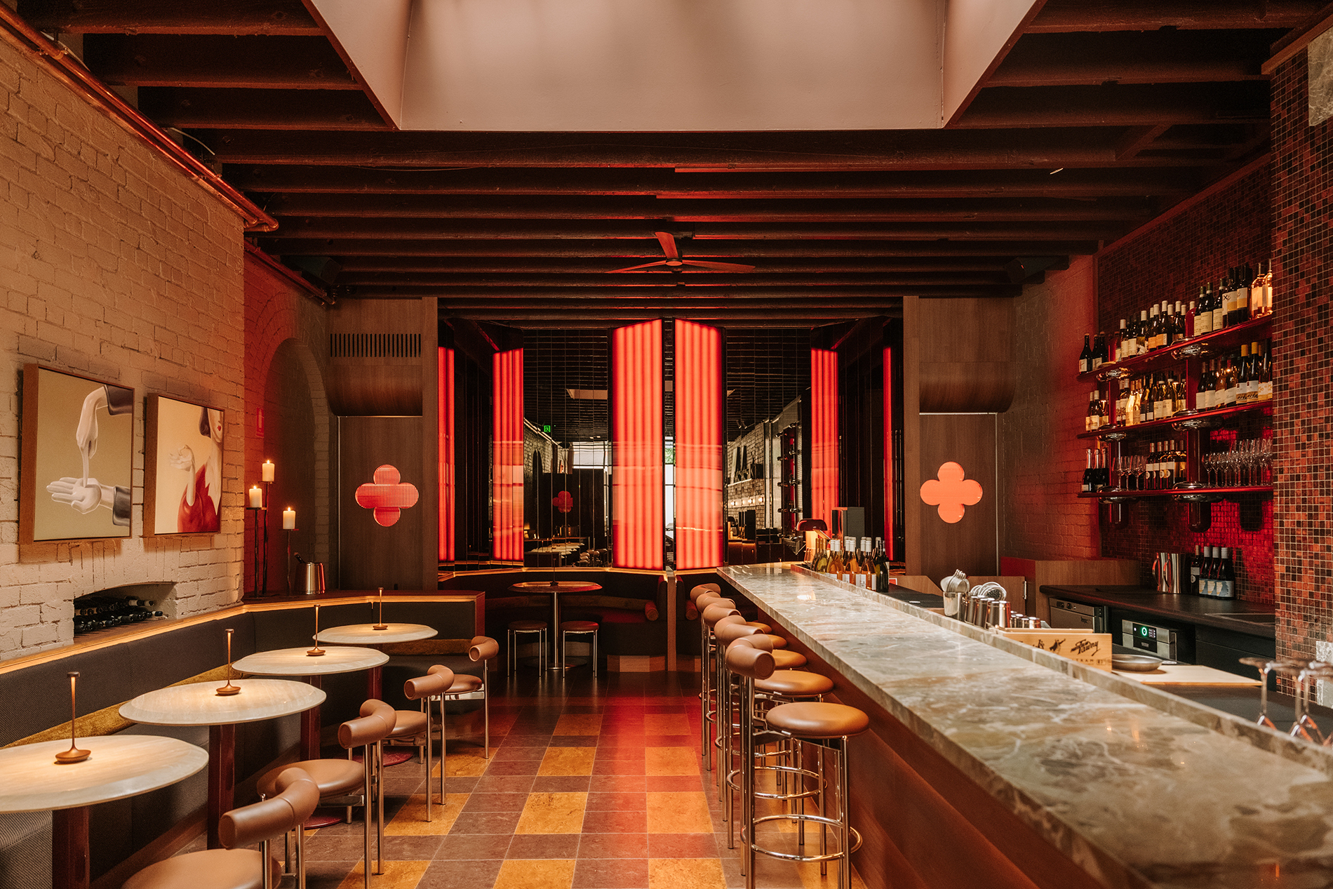 A sleek wine bar with red lighting.