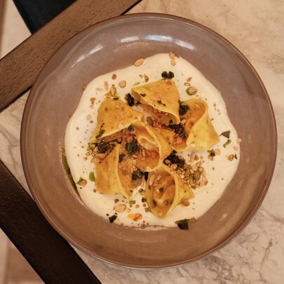 A ravioli pasta dish in a restaurant.