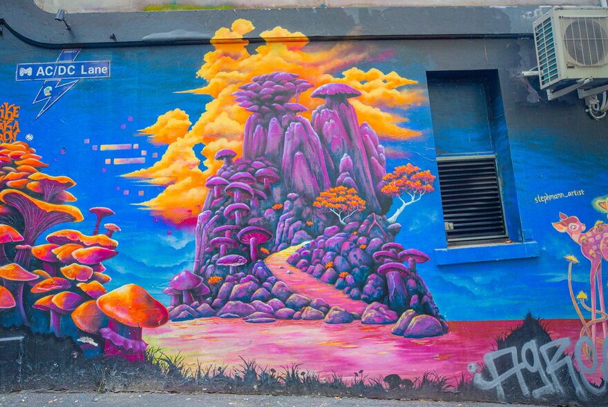 A colourful street art mural of mushrooms