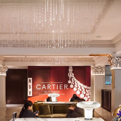 A hotel lobby with a chandelier.