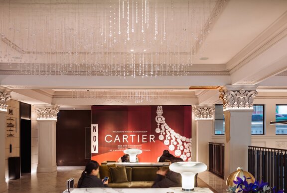 A hotel lobby with a chandelier.