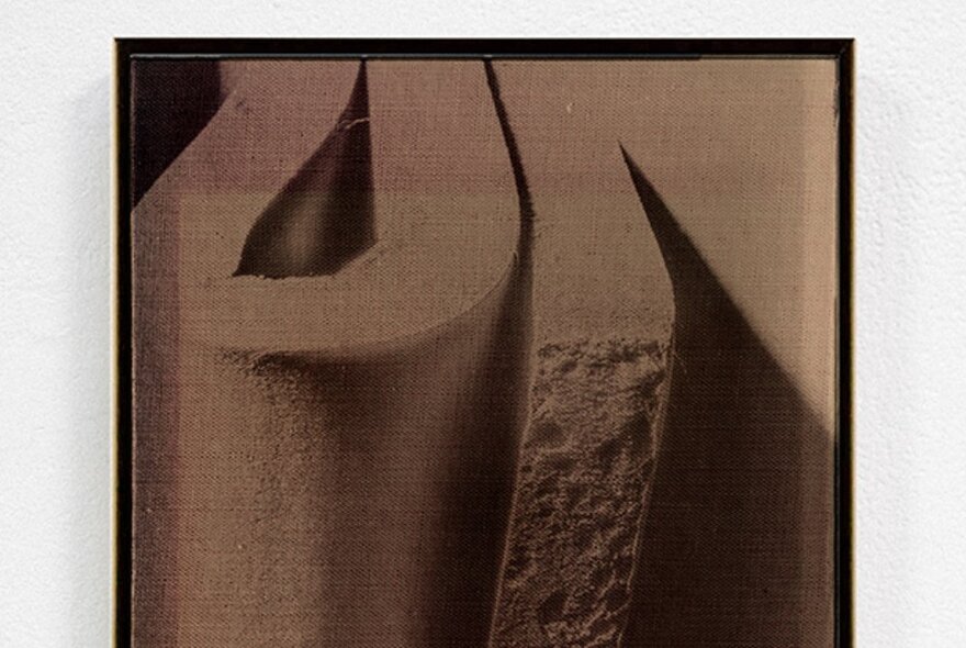 Artwork of brutalist sculptural image in sepia.