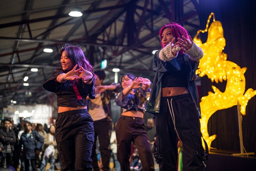 Traditional Malaysian dancers on stage in Shed D at the Queen Victoria Market.