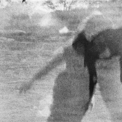 Abstract and grainy overlayed image of people in black and white