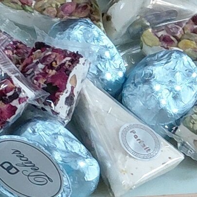 A tray containing a selection of pre-packaged snacks and nuts.