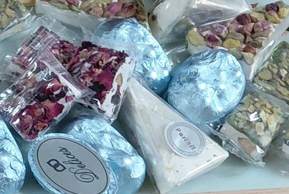 A tray containing a selection of pre-packaged snacks and nuts.