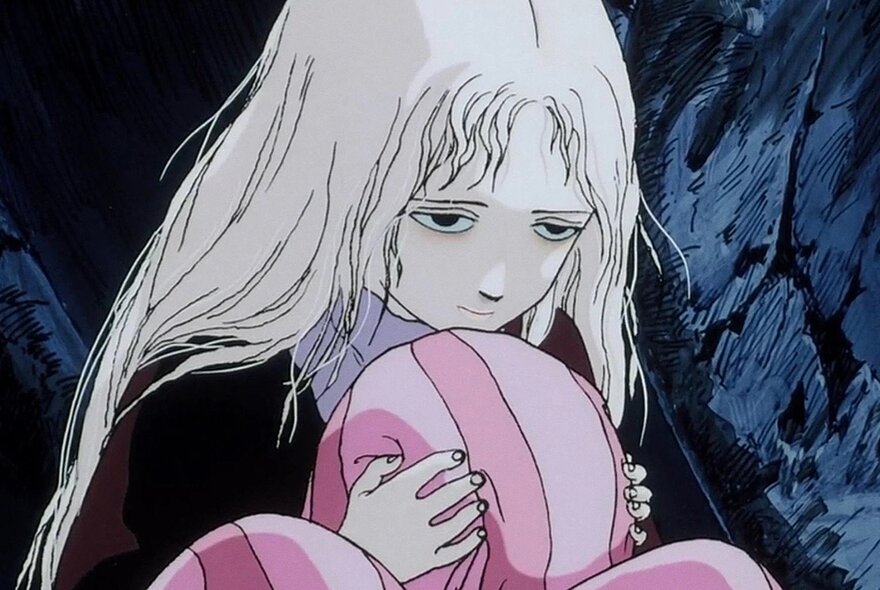 Still from a Japanese Anime movie showing a young blonde girl hugging something pink very tightly.