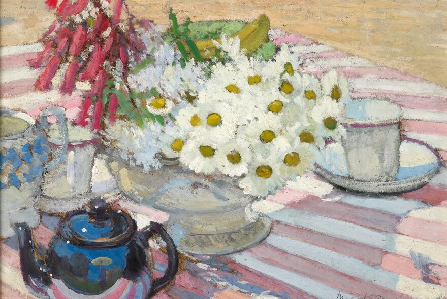 A painting by Margaret Preston showing a table with a teapot and cups and saucers with a large bowl of daisies and other flowers.