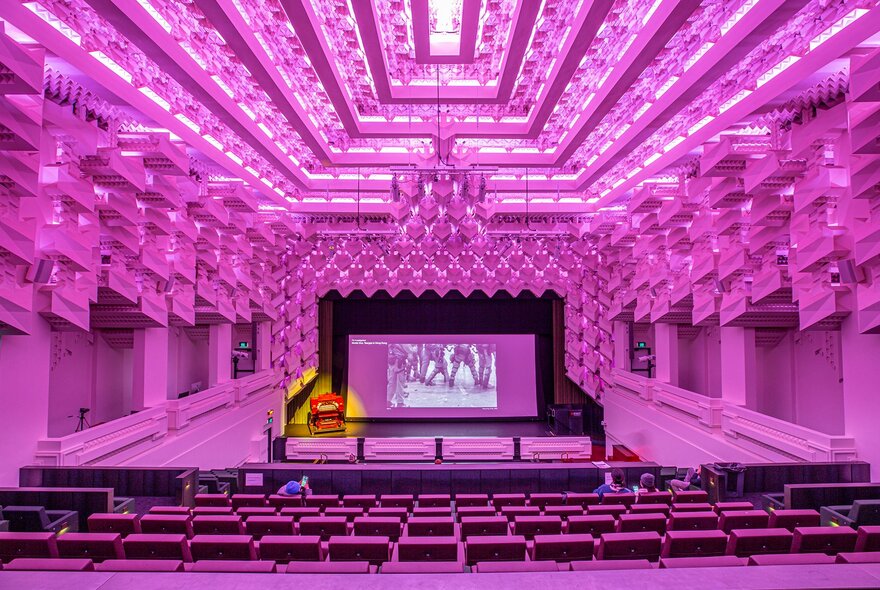 The Capitol theatre lit up pink across the seats and jewel-like ceiling.
