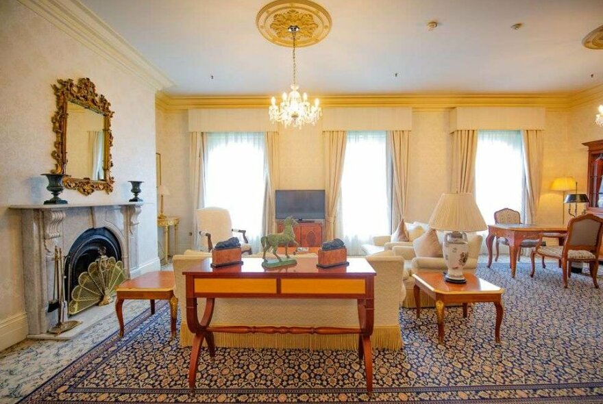 An old-fashioned hotel room with a chandelier