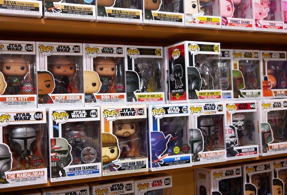 Wall of plastic figurines in boxes.