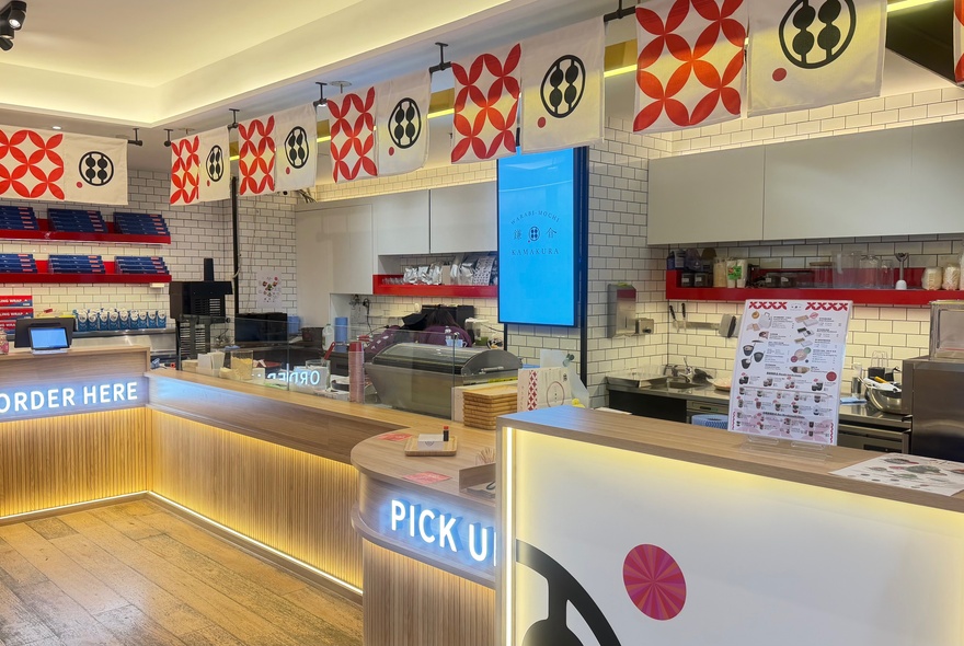 Japanese confectionery store with counters and worktops, signage and banners.