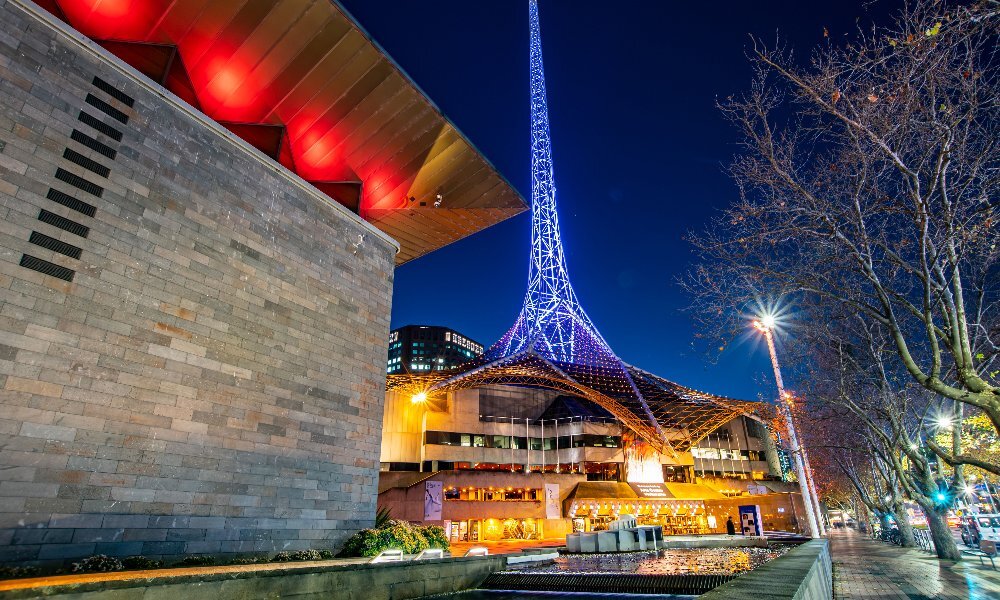 The NGV and Arts Centre lit up on a winter night.