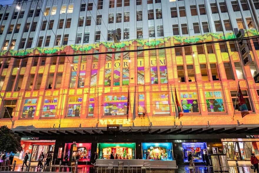 Projections on a Myer building at night.