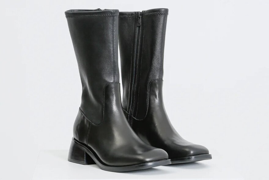 A pair of black leather boots