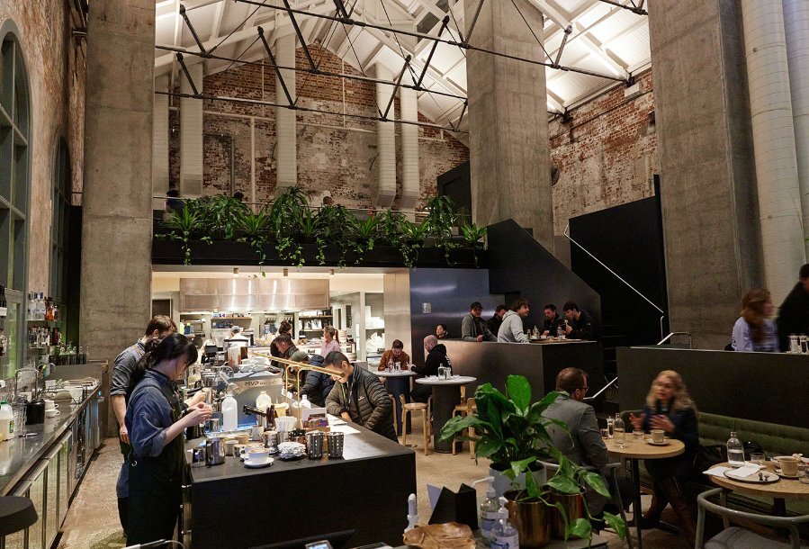A large cafe with high ceilings.