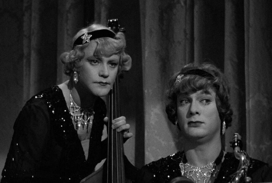 Actors Jack Lemmon and Tony Curtis dressed in drag in their roles as Daphne and Josephine in the 1959 comedy film Some Like It Hot. 