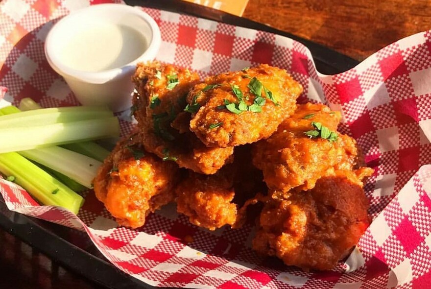 Fried nuggets, sauce and celery.