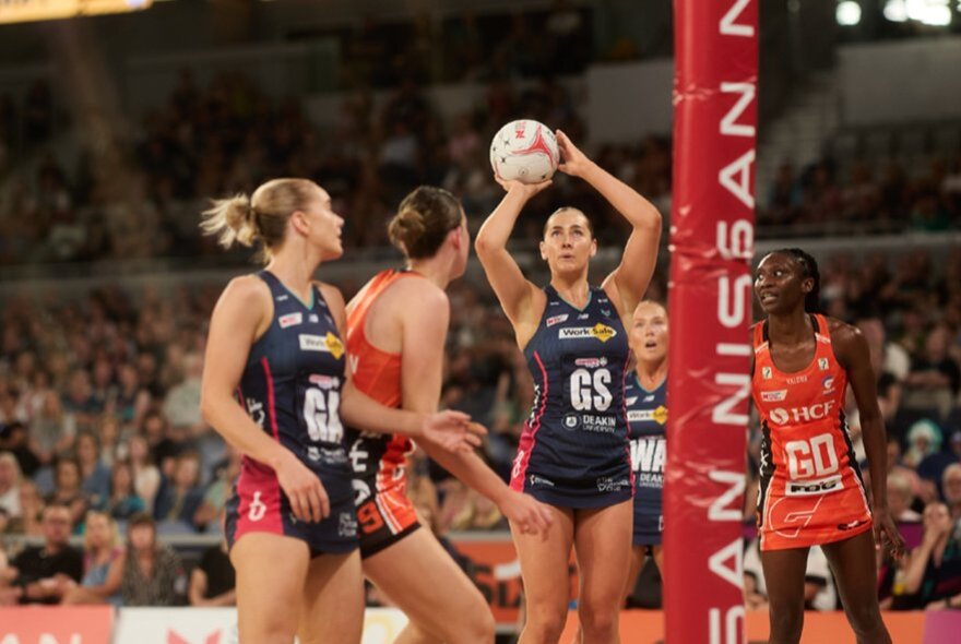 A netball match featuring the Melbourne Vixens and the Giants. 